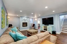 Inviting Colors for Basement Makeovers: Ideas to Elevate Your Space Basements often get the short end of the stick when it comes to home design. They tend to be dark, underused, or even forgotten spaces in many homes. However, with the right splash of color, your basement can become one of the most inviting areas in your house. This blog post aims to inspire you with vibrant color ideas to transform your basement into a lively and welcoming space. Understanding the Basics of Basement Design Before we jump into color palettes, it's essential to understand that basements present unique challenges and opportunities. Since basements are typically below ground level, they often lack natural light and can feel cold or cramped. This is where color becomes your best friend. Choosing the right colors for basements can help counteract these challenges by brightening the space and making it feel more open and comfortable. Tips for Selecting Colors Consider Light: Since basements may have limited natural light, opt for lighter shades to make the space feel airy and expansive. Use Color Psychology: Different colors evoke different emotions. Think about how you want the space to feel and choose colors that align with that mood. Light and Airy Palette If your goal is to make your basement feel brighter and bigger, a light and airy color palette is your best bet. These colors can lift the mood and create an illusion of space, even in the most cramped basements. Examples of Light and Airy Colors Soft Whites and Creams: These colors reflect light and make any space feel larger and more open. Pastel Blues and Greens: These shades add a touch of color while maintaining a serene and spacious feel. Try painting your walls in a soft white and adding pastel accents through furniture or decor. This combination can breathe new life into your basement, making it feel like an extension of the rest of your home. Warm and Cozy Tones For those who want their basements to feel like a cozy retreat, warm and earthy tones are the way to go. These colors create a welcoming atmosphere, perfect for relaxation or family gatherings. Examples of Warm and Cozy Colors Earthy Browns and Beiges: These colors add warmth and depth, making your basement feel comfy and inviting. Deep Reds and Oranges: These hues can make a space feel more intimate and snug. Using warm tones on one or two accent walls, paired with neutral furniture, can create a balanced and cozy environment that's perfect for curling up with a book. Bold and Playful Accents If you're looking to infuse some personality and fun into your basement, consider adding bold and playful colors as accents. These colors can liven up the space and create focal points without overwhelming it. Tips for Adding Bold Colors Use Sparingly: Bold colors can be overpowering if overdone. Use them for small accents like cushions, artwork, or a feature wall. Balance with Neutrals: Pair bold accents with neutral tones to keep the space balanced and harmonious. Think bright yellows or vibrant teals for a playful touch. Even a colorful rug or a piece of art can bring in just the right amount of pizzazz. Tips for Application and Execution Transforming your basement with color is not just about picking the right shades. Here are some practical tips to achieve your desired effect: Prep Your Surfaces: Clean and prime walls for the best paint adhesion. Test Colors: Try small patches of paint on your walls to see how they look with the lighting at different times of day. Consider Lighting: Good lighting can enhance your chosen colors. Use layered lighting options, including overhead lights, lamps, and wall sconces, to highlight different areas. Conclusion Colors for basements can truly redefine the space, turning it from dull and dreary into vibrant and welcoming. Whether you choose light and airy shades, warm and cozy tones, or bold and playful accents, the right colors can elevate your basement to new heights. Experiment with these ideas and find what works best for your home. We’d love to hear about your basement transformations, so please share your experiences and ideas in the comments section below! Ready to start your basement makeover? Let's bring those colors to life!